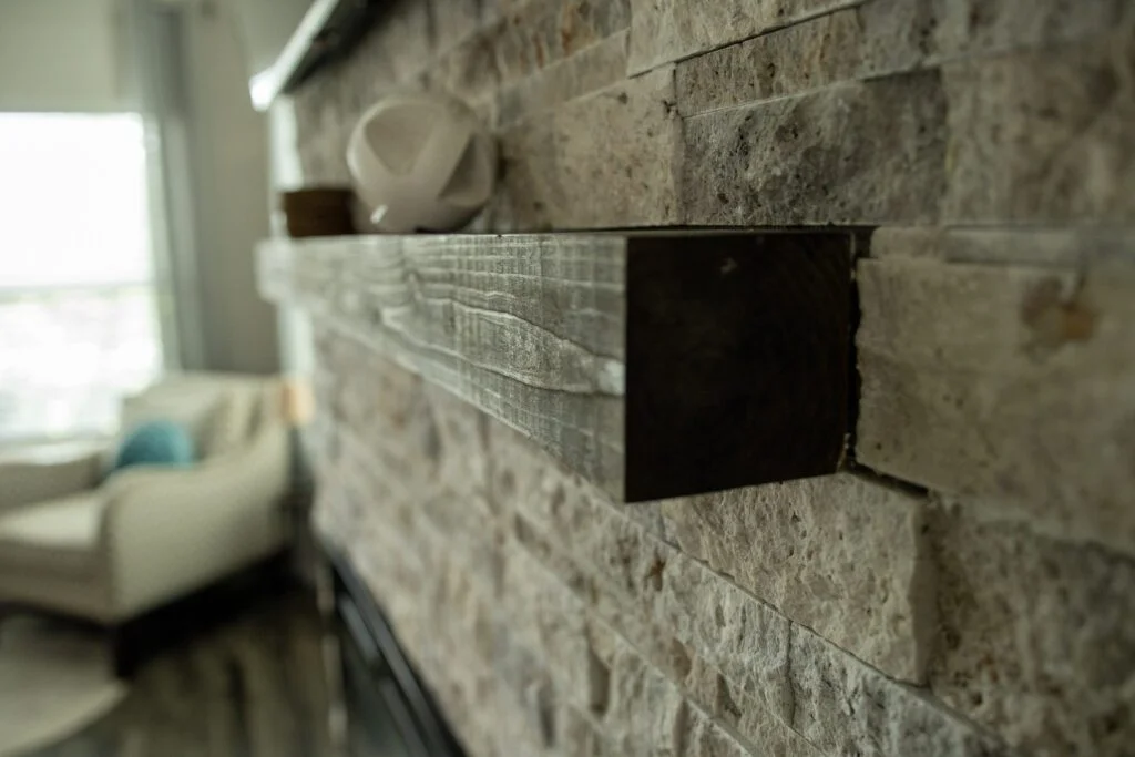 Picture showing wooden mantel above fireplace