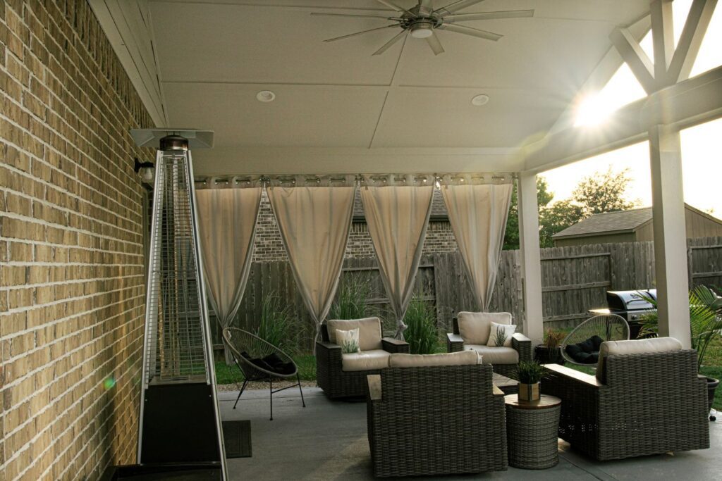 Patio with curtains and conversation group